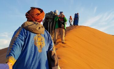 helping hand, golden sands, colorful, humanity, sahara, climb, hold on, together, snapshot, morocco, africa, blue help, blue human, blue together, sahara, morocco, morocco, morocco, morocco, morocco