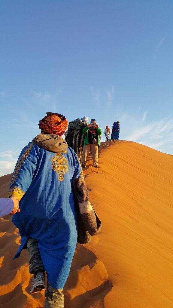 helping hand, golden sands, colorful, humanity, sahara, climb, hold on, together, snapshot, morocco, africa, blue help, blue human, blue together, sahara, morocco, morocco, morocco, morocco, morocco