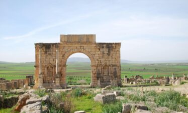 Ancient Roman triumphal arch at Volubilis in Mequinez, Morocco, a UNESCO World Heritage site.