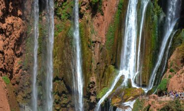 Experience the stunning natural beauty of Ouzoud Waterfalls cascading over rugged rocks.