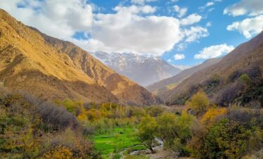 Beautiful mountain landscape in Imlil, Morocco with clear skies and vibrant greenery.
